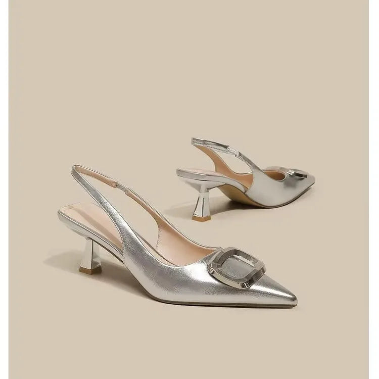 Stylish silver elegant slingback shoes with a chic pointed toe and unique heel design