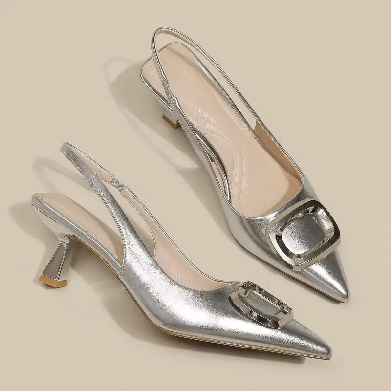 Stylish silver elegant slingback shoes with a sleek design and a modern buckle detail
