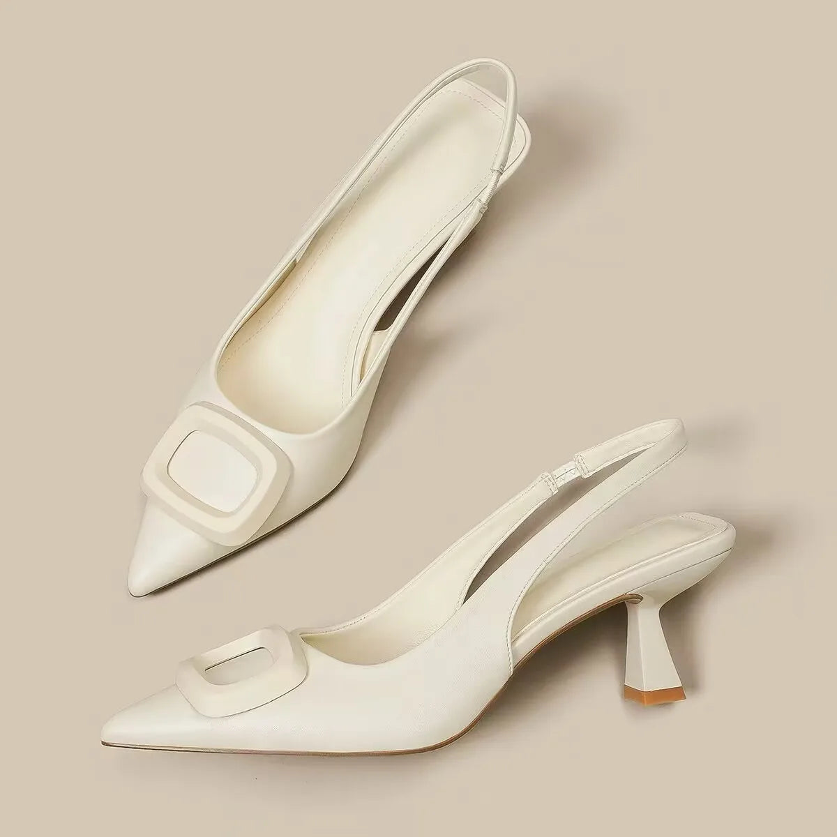 White elegant slingback shoes with pointed toes and stylish buckle detail for sophisticated outfits