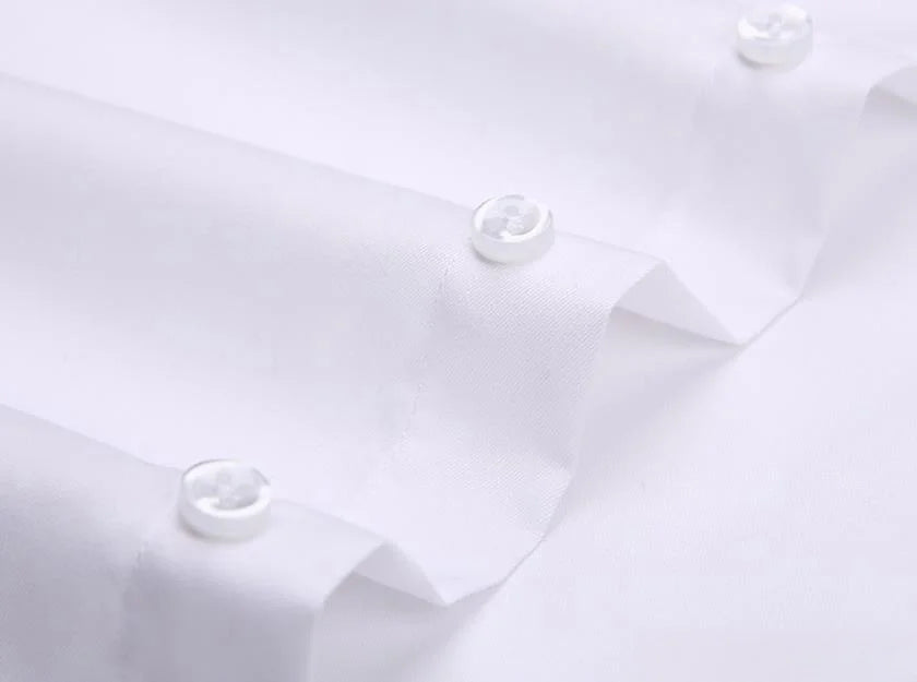 Close-up of white long sleeve anti-wrinkle office shirt with button detailing for a polished look