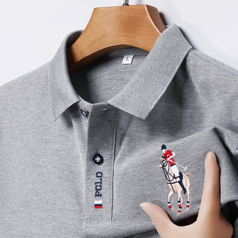 Stylish men's embroidered polo in grey with a detailed horse rider design on the chest