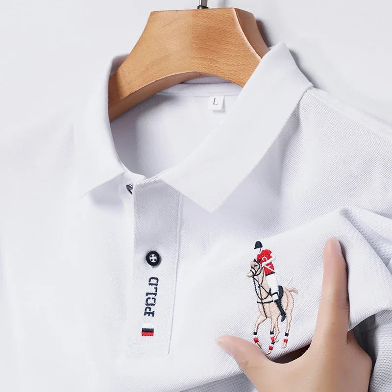 Stylish men's embroidered polo in white featuring a horse rider design on the sleeve