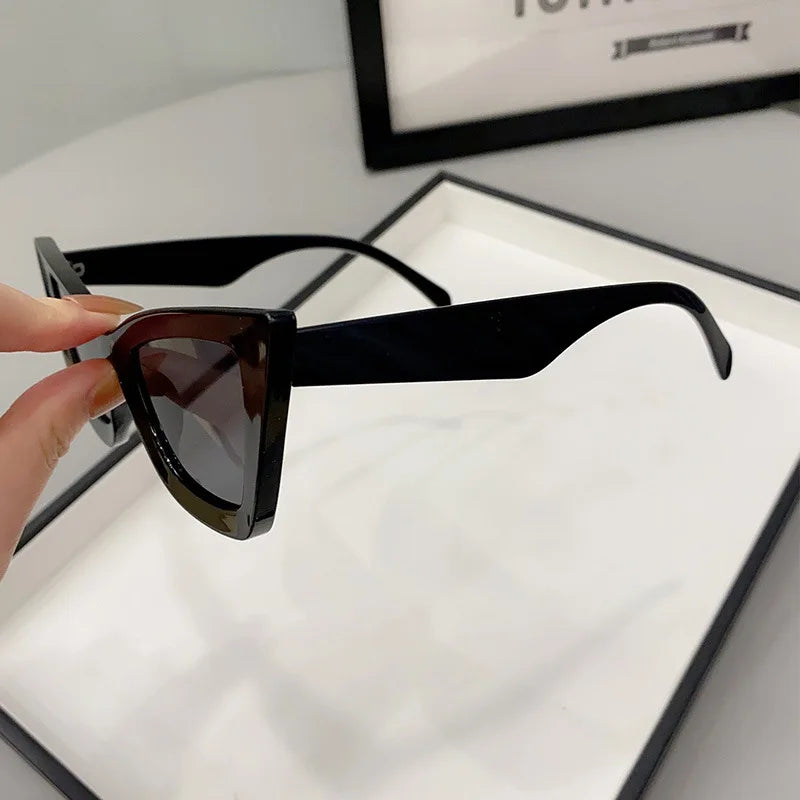 VaultHaus black vintage cat eye sunglasses for women with glossy frame and dark lenses