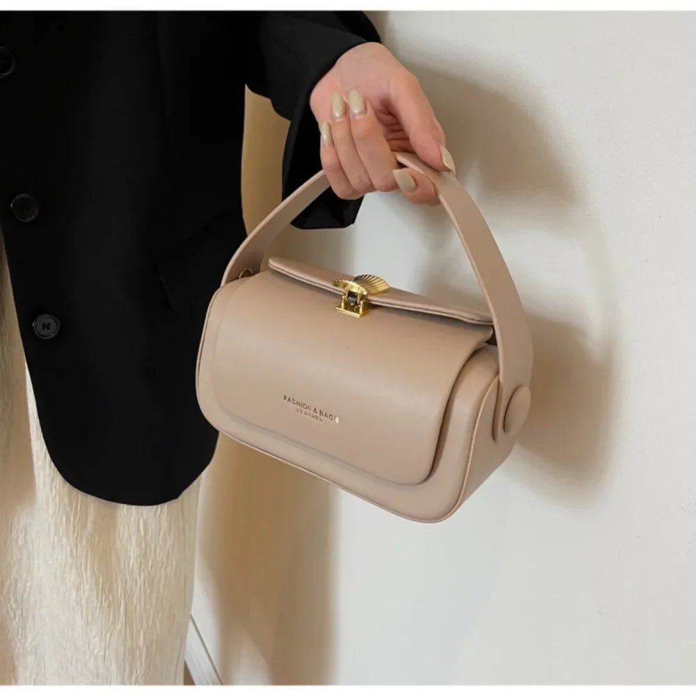 Stylish woman's hand holding a Women's Classic Versatile Retro Square Bag in beige, perfect for various outfits