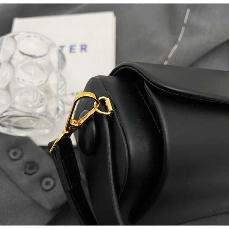 Close-up of Women's Classic Versatile Retro Square Bag in black with gold hardware and strap detail