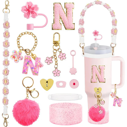 VaultHaus 11 piece Tumbler Cup Accessory Kit in pink and gold with charms, keychains, and handle strap