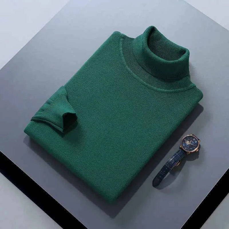 Men's cashmere cotton turtleneck jumper in green, displayed with a wristwatch on a table