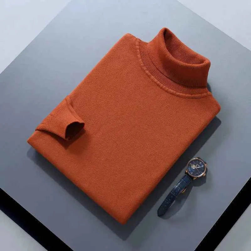 VaultHaus men's cashmere cotton turtleneck jumper in rust colour, displayed with a watch on grey background