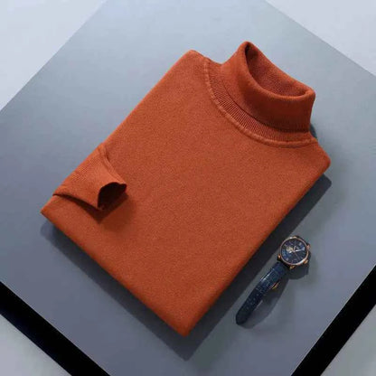 VaultHaus men's cashmere cotton turtleneck jumper in rust colour, displayed with a watch on grey background