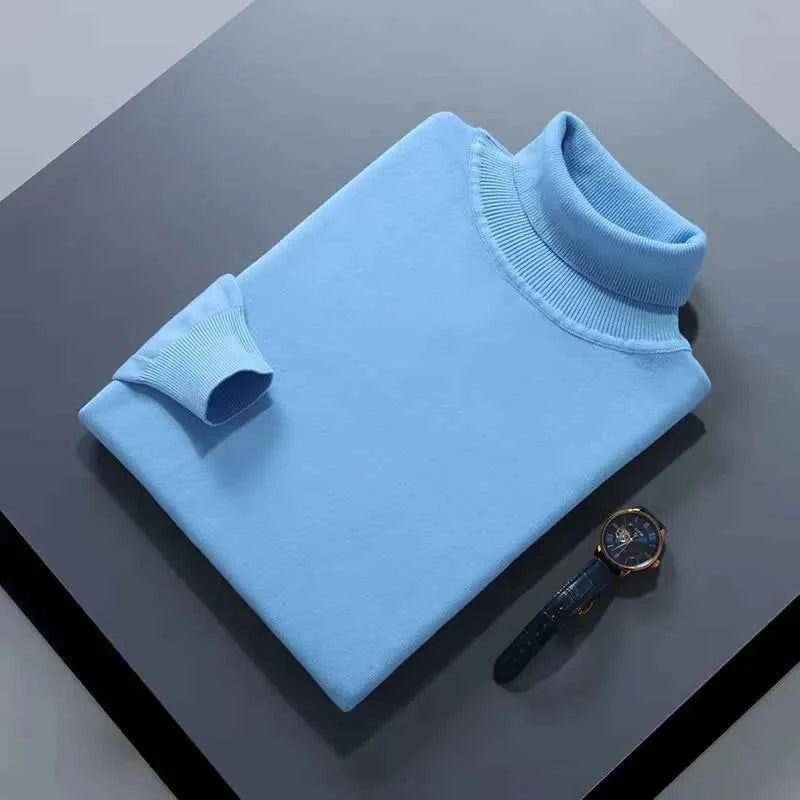 VaultHaus men's cashmere cotton turtleneck jumper in light blue, folded neatly with a watch beside it