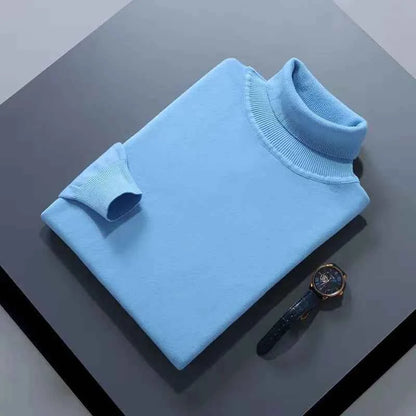 VaultHaus men's cashmere cotton turtleneck jumper in light blue, folded neatly with a watch beside it
