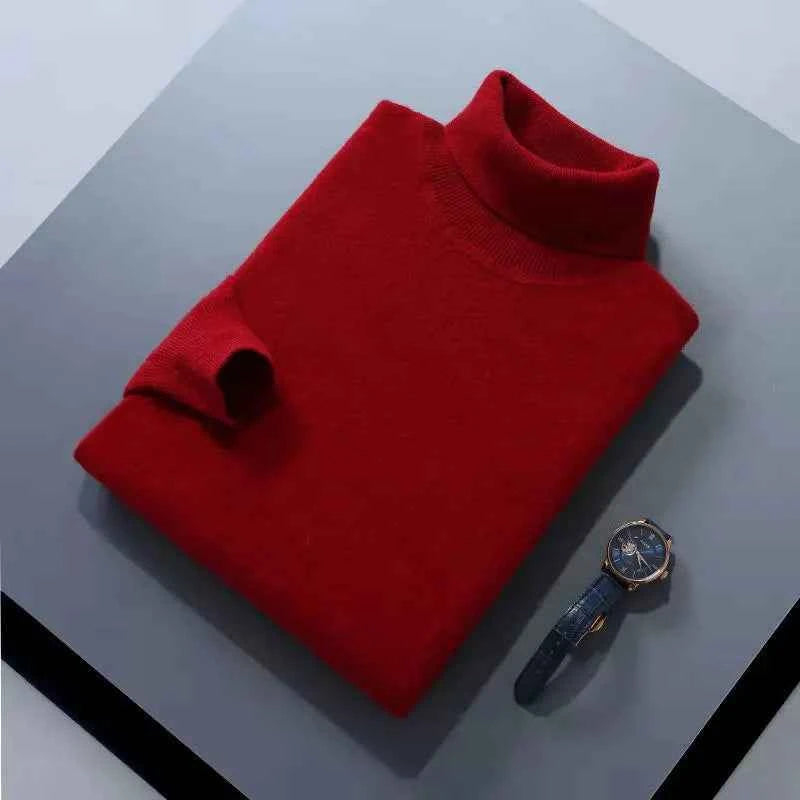 Red men's cashmere cotton turtleneck jumper folded neatly with a stylish watch beside it