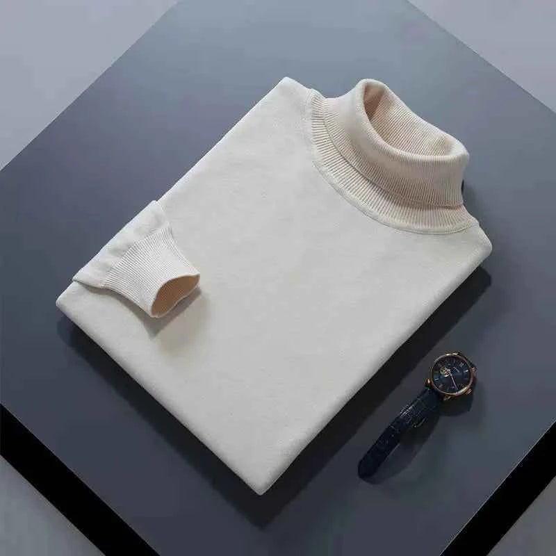 VaultHaus men's cashmere cotton turtleneck jumper in cream laid flat on a table with a watch