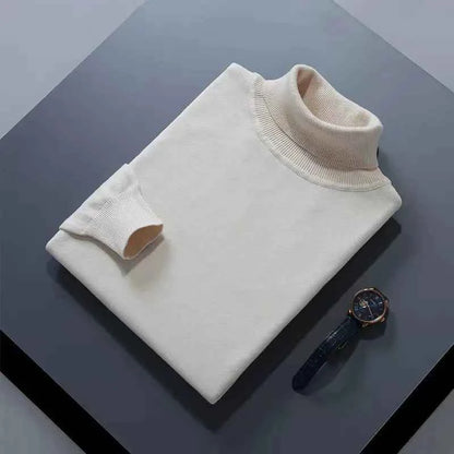 VaultHaus men's cashmere cotton turtleneck jumper in cream laid flat on a table with a watch