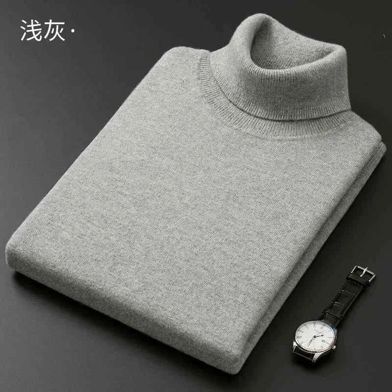 Grey men's cashmere cotton turtleneck jumper folded neatly with a watch beside it