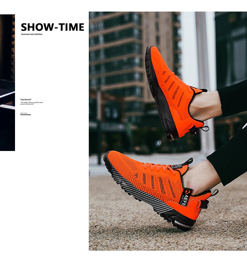 VaultHaus vibrant orange lightweight athletic sneakers for men with black soles worn outdoors