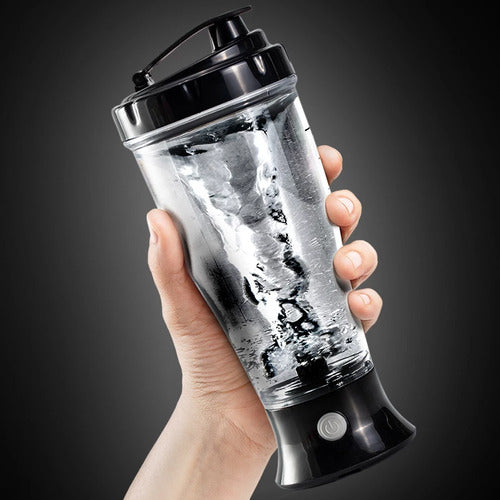 VaultHaus automatic protein shaker bottle with black lid held in hand mixing protein powder