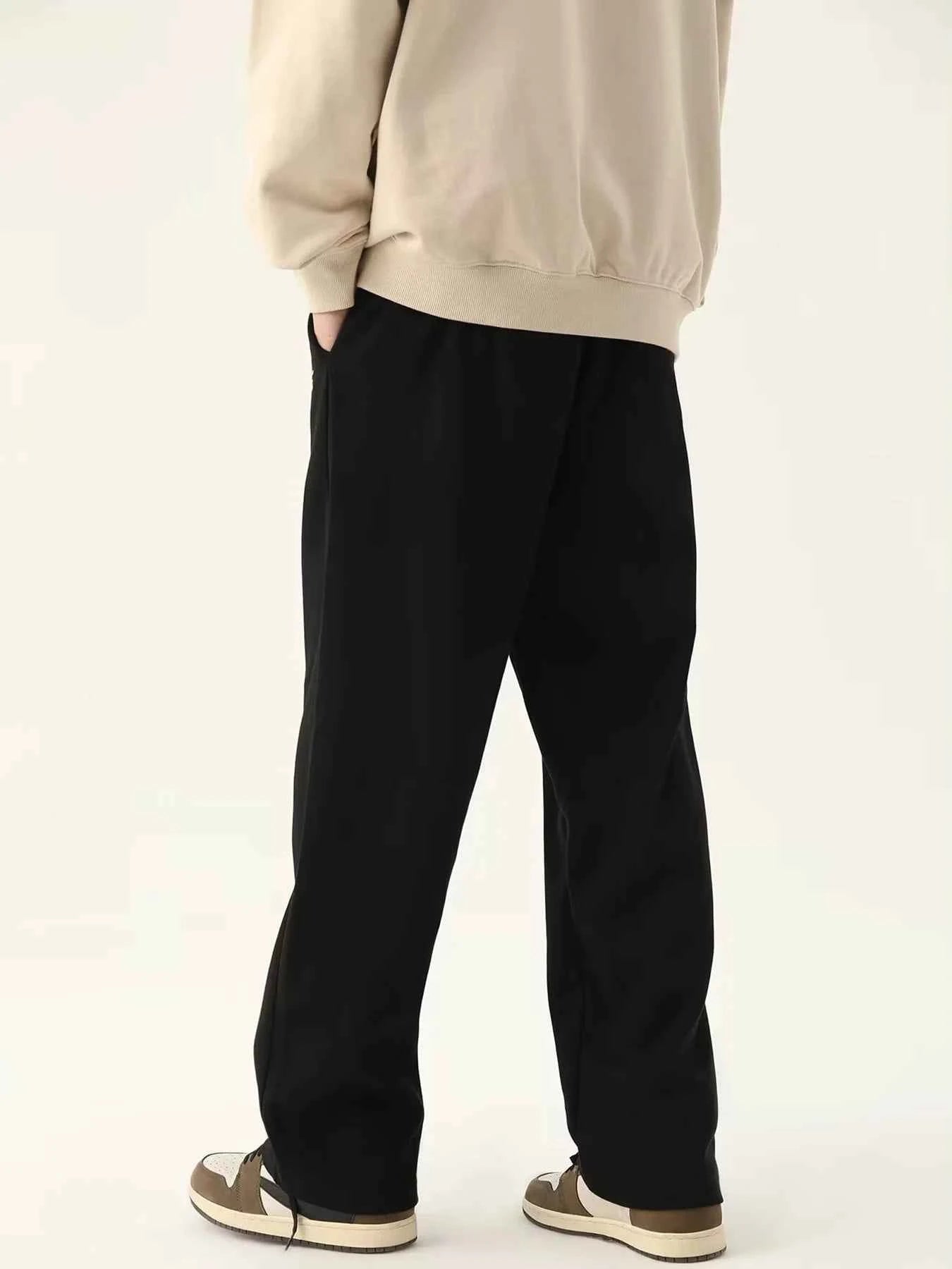 VaultHaus men's loose fit joggers in black with a relaxed silhouette and side pockets