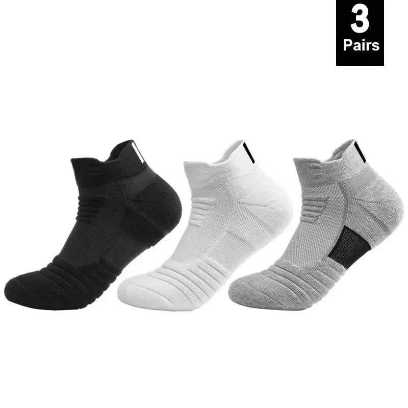 Three pairs of breathable anti-slip cotton sports socks for men, in black, white, and grey.