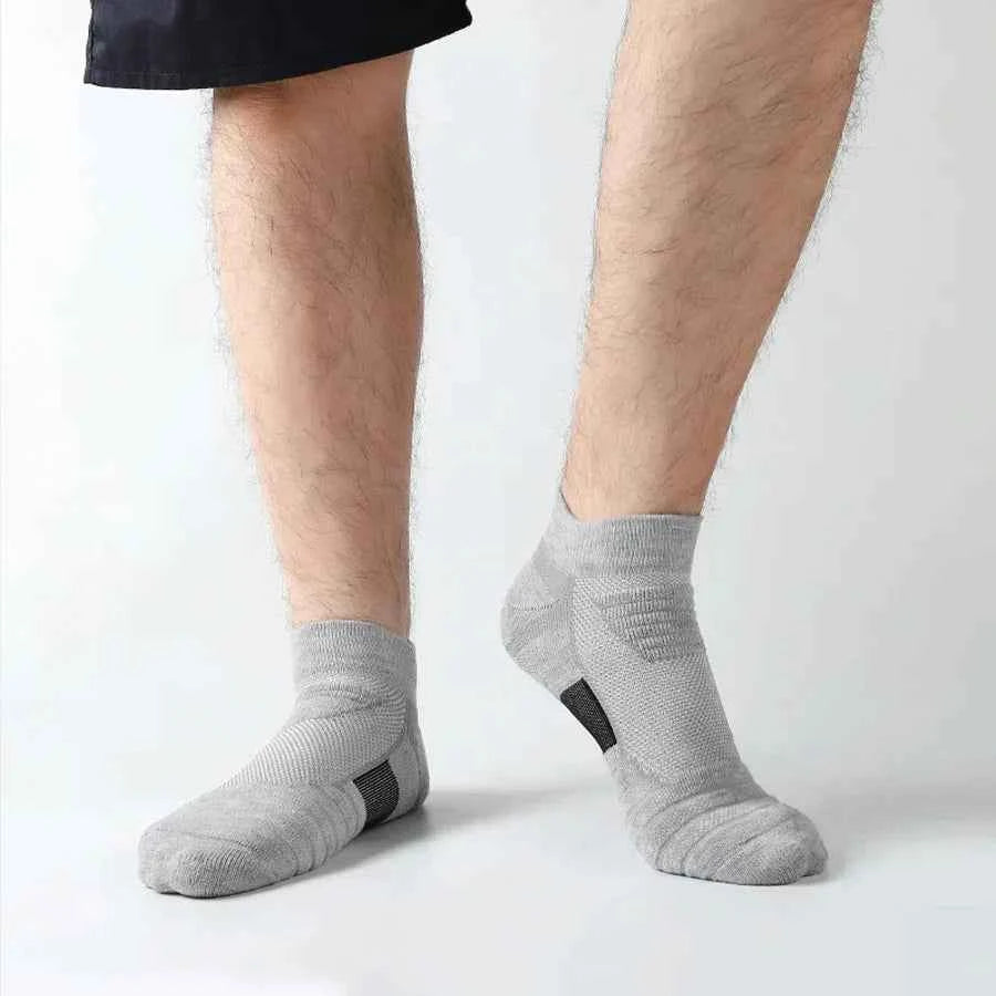 VaultHaus breathable anti-slip cotton sports socks for men in grey on a model's feet
