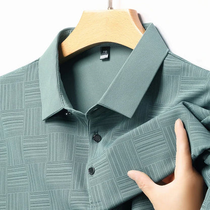 VaultHaus stylish business casual polo for men in textured green fabric hanging on a wooden hanger
