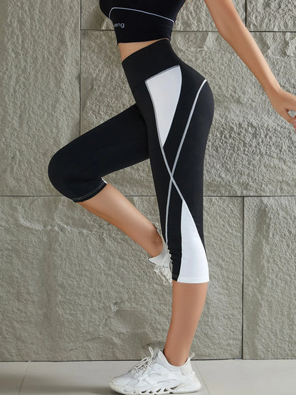 Black and white calf-length sport leggings with a stylish design for active wear