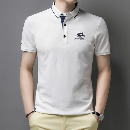 Stylish white comfortable men's polo top with short sleeves and logo detail from VaultHaus