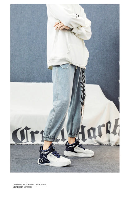 VaultHaus comfortable non slip lace up men's sneakers in white and navy worn with casual jogger pants