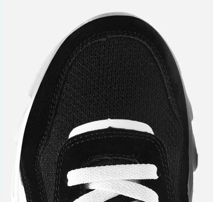 Top view of VaultHaus comfortable unisex walking sneakers in black and white with classic lace design