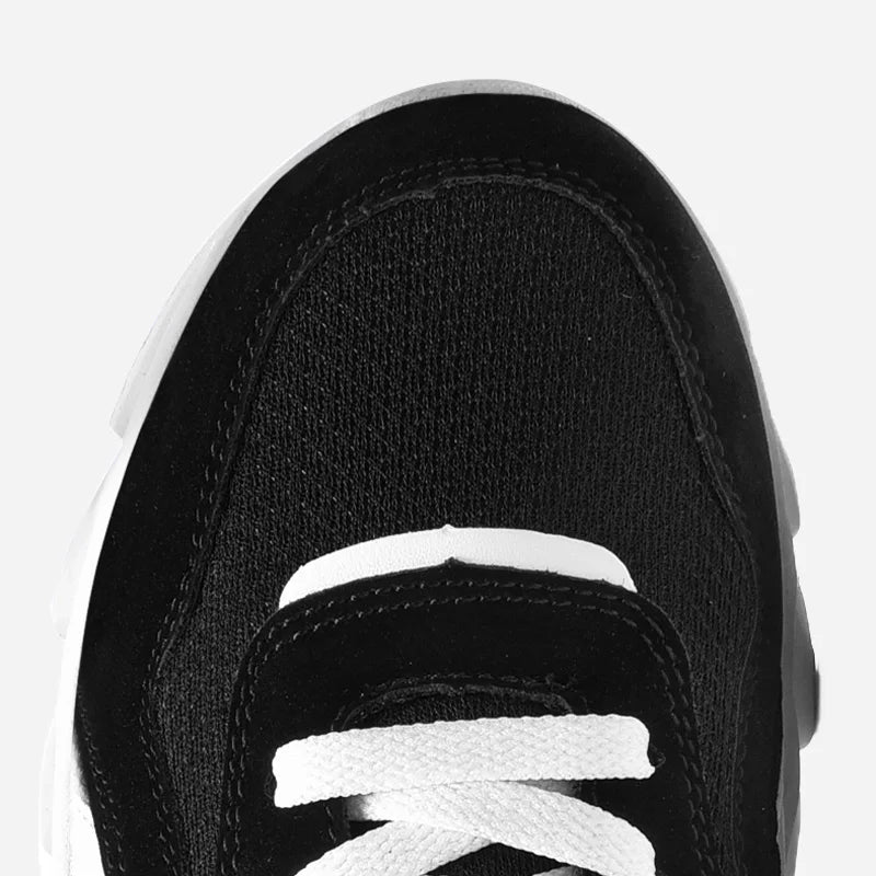 Top view of VaultHaus comfortable unisex walking sneakers in black with white laces and stylish design