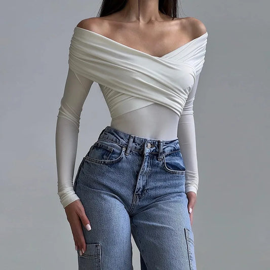 Elegant white sexy off shoulder bodysuit paired with high-waisted blue jeans for a chic look