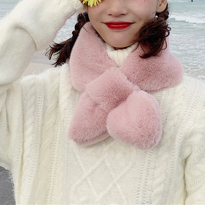 Stylish pink cosy faux fur scarf for cold weather worn with a knitted sweater by VaultHaus