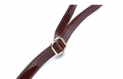 Close-up of adjustable strap detail on crocodile print tote bag by VaultHaus with shiny finish