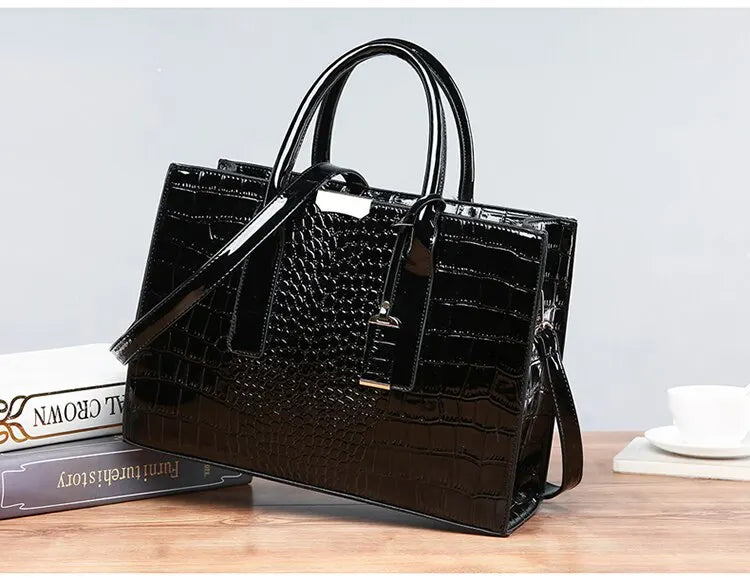 Stylish black crocodile print tote bag by VaultHaus with dual handles and adjustable strap