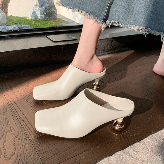 VaultHaus designer spring loafers for women in cream with unique gold spherical heels