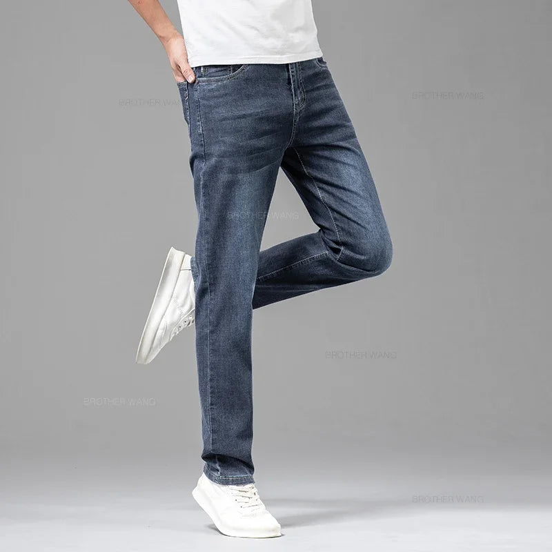 VaultHaus comfortable men's fashion jeans in dark blue, styled with a casual t-shirt and white sneakers
