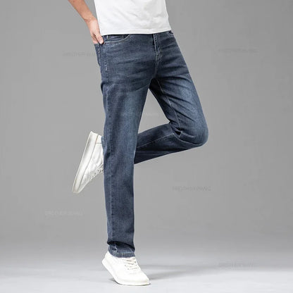 VaultHaus comfortable men's fashion jeans in dark blue, styled with a casual t-shirt and white sneakers