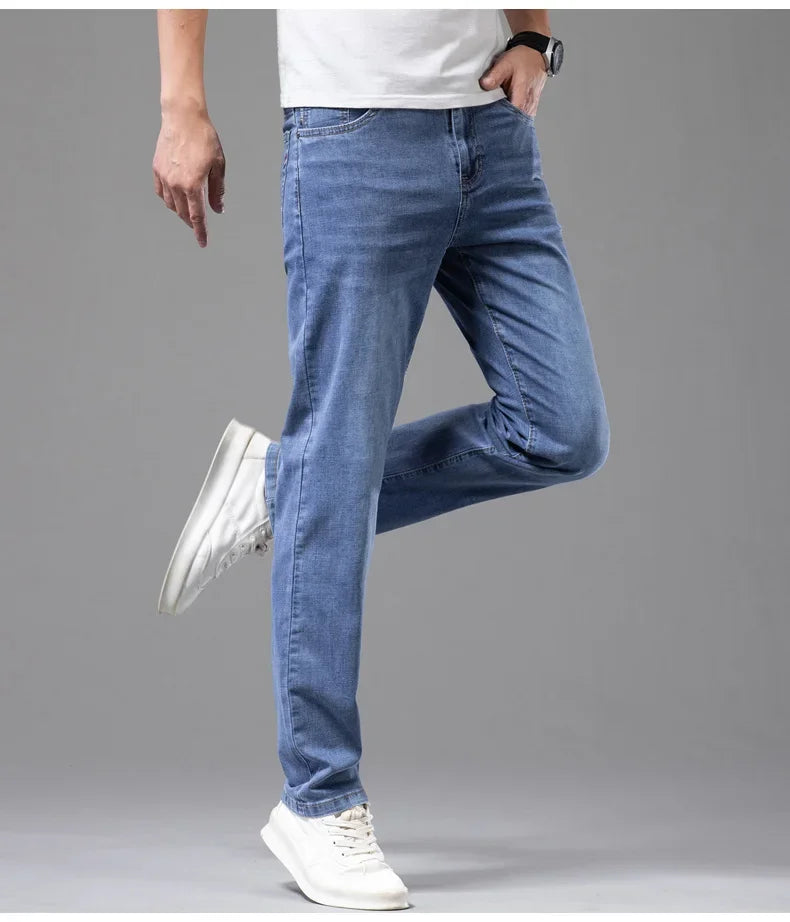 VaultHaus comfortable men's fashion jeans in light blue, styled with a casual white t-shirt and sneakers