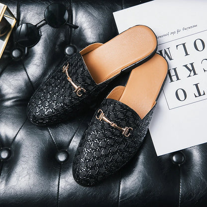 VaultHaus black textured leather fashion mules for men with gold buckles on black leather surface