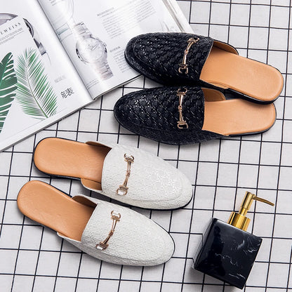 VaultHaus black and white fashion mules for men with quilted design and metal buckle detail.