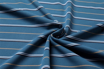 Close-up of soft fabric featuring blue and yellow stripes for a business casual short sleeve polo