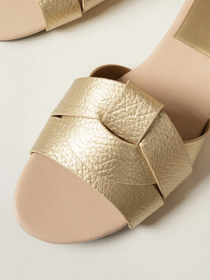 Gold flat designer sandals 2025 featuring a stylish braided strap for casual summer outings