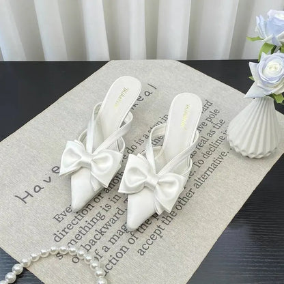 Elegant French style pink slippers with bow detail for chic and comfortable wear