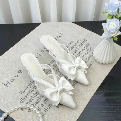 Elegant white French style pink slippers with bow detail for chic indoor wear