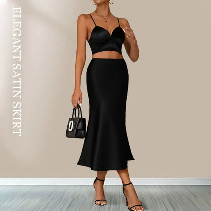VaultHaus Women's satin elegant midi skirt in black paired with a stylish crop top and heels