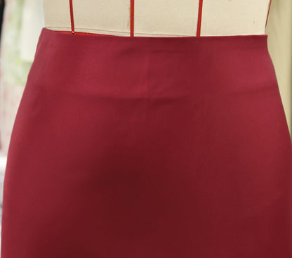 Women's satin elegant midi skirt in burgundy with a smooth, luxurious finish