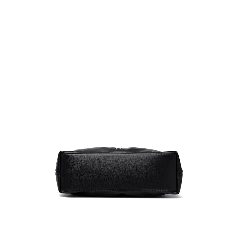 Bottom view of a high quality PU leather handbag from VaultHaus, showcasing its sleek design and durable material.