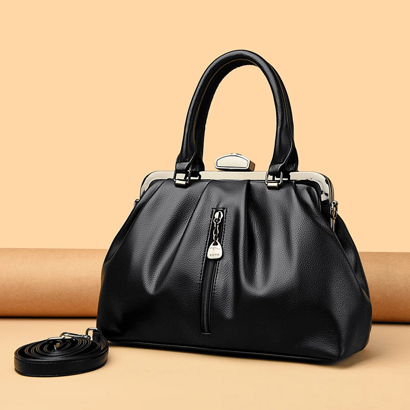Stylish high quality PU leather handbag with silver accents and detachable shoulder strap