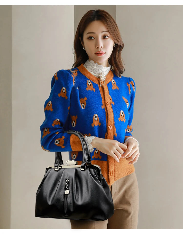 Stylish woman with high quality PU leather handbag paired with a colorful cardigan and neutral pants
