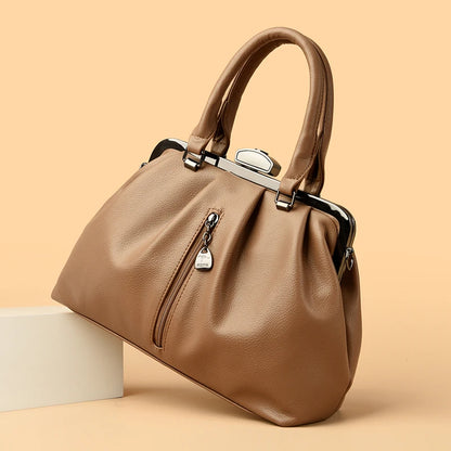 Stylish high quality PU leather handbag in tan with a sleek design and silver accents